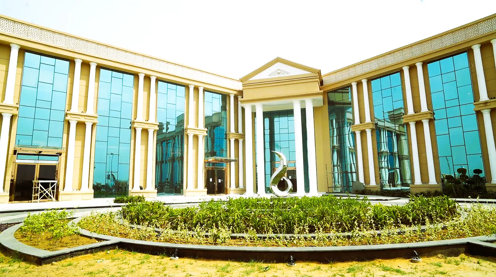 MET City clubhouse exterior with circular driveway