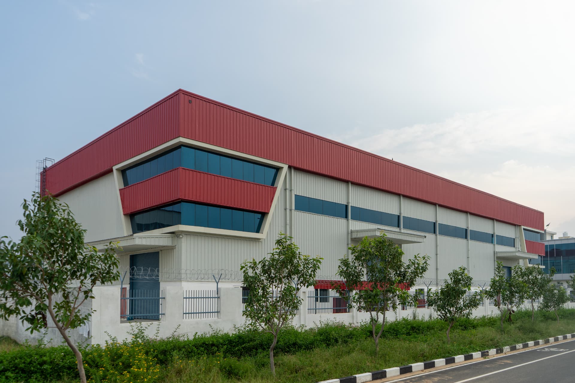 Modern manufacturing plant along a MET City arterial road
